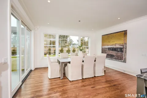a large kitchen with kitchen island granite countertop a sink and cabinets