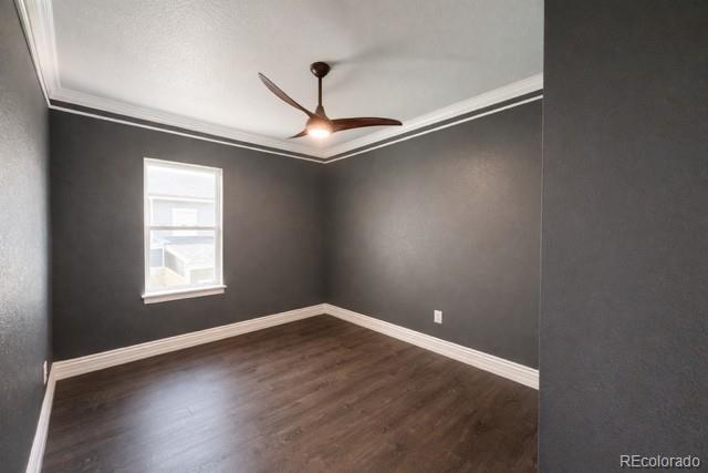 2768 Renshaw Street Strasburg, CO 80136 - Photo 4 of 14 an empty room with wooden floor and windows