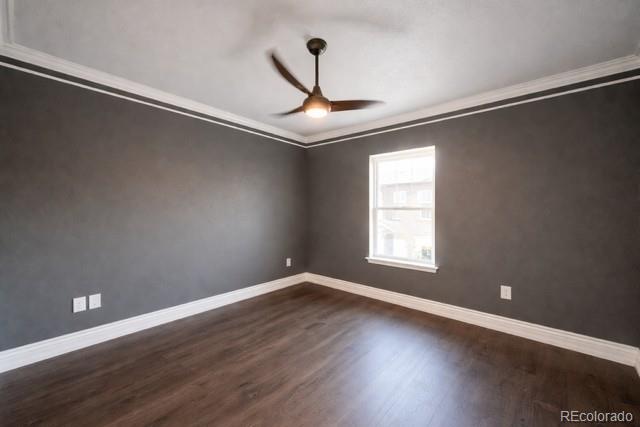 2768 Renshaw Street Strasburg, CO 80136 - Photo 5 of 14 a view of an empty room with wooden floor and a window