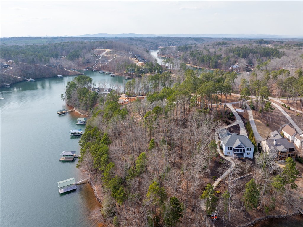 537 Peninsula Road West Union, SC 29696 - Photo 8 of 15 An aerial view showcases a tranquil lake with verdant surroundings and a collection of waterfront homes.