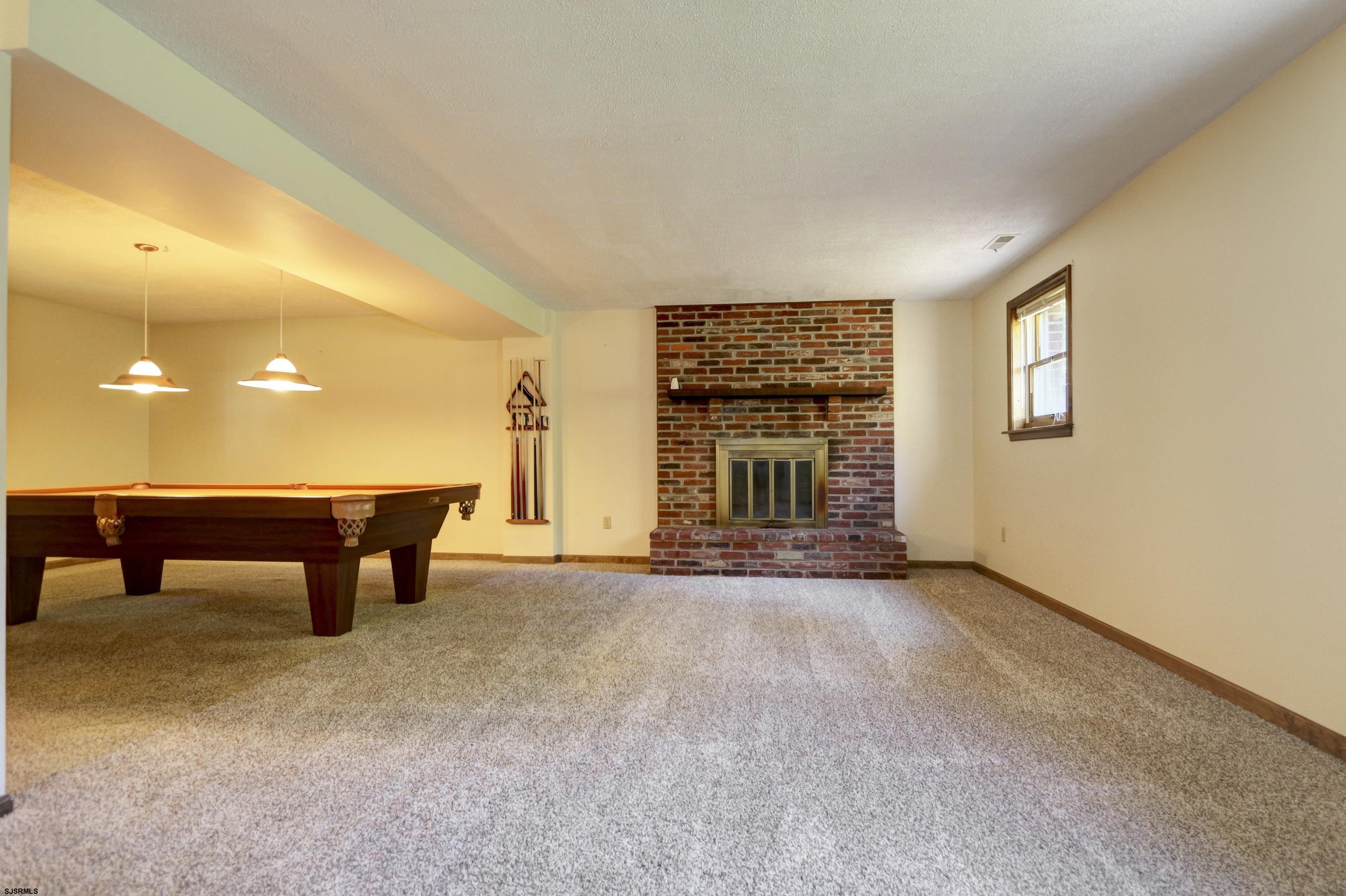 2203 Evergreen Drive Hammonton, NJ 08037 - Photo 24 of 39 a view of an empty room with a fireplace