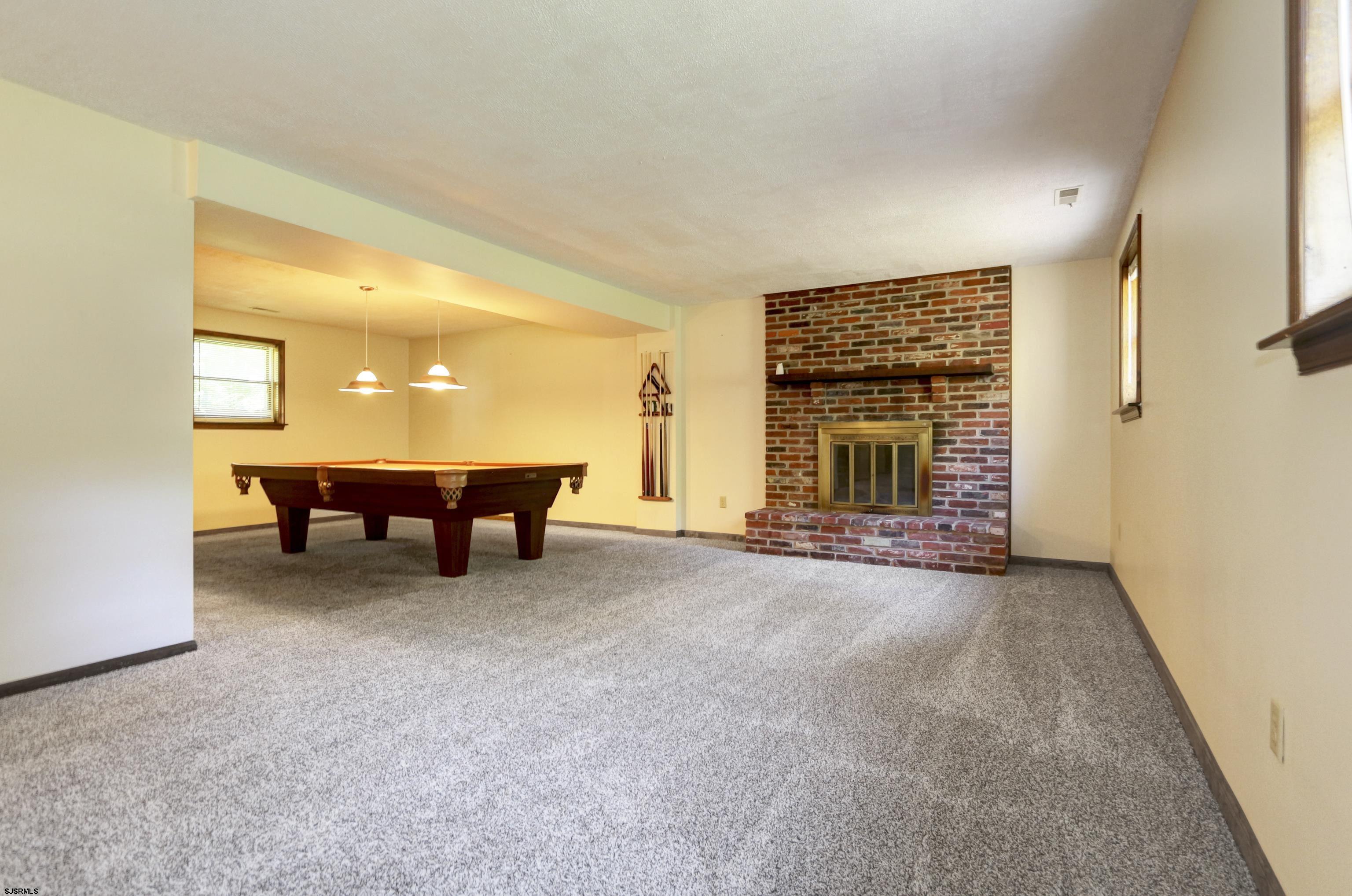 2203 Evergreen Drive Hammonton, NJ 08037 - Photo 25 of 39 a view of a livingroom with a fireplace and window