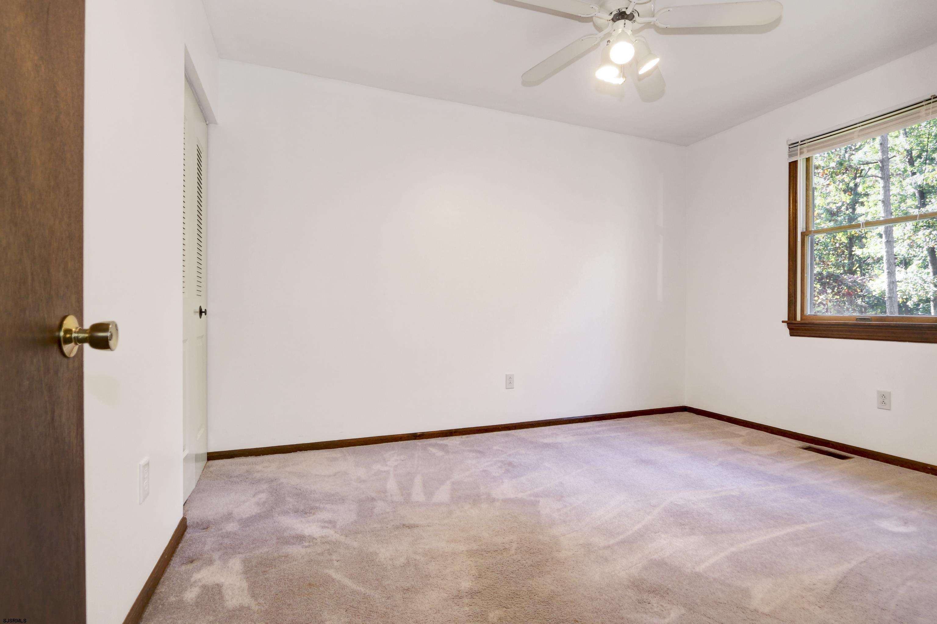 2203 Evergreen Drive Hammonton, NJ 08037 - Photo 4 of 39 a view of an empty room with a window