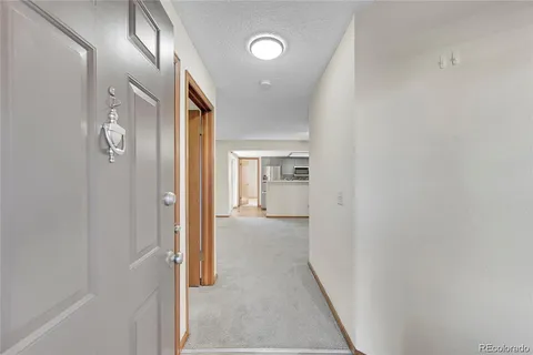 a view of hallway with livingroom