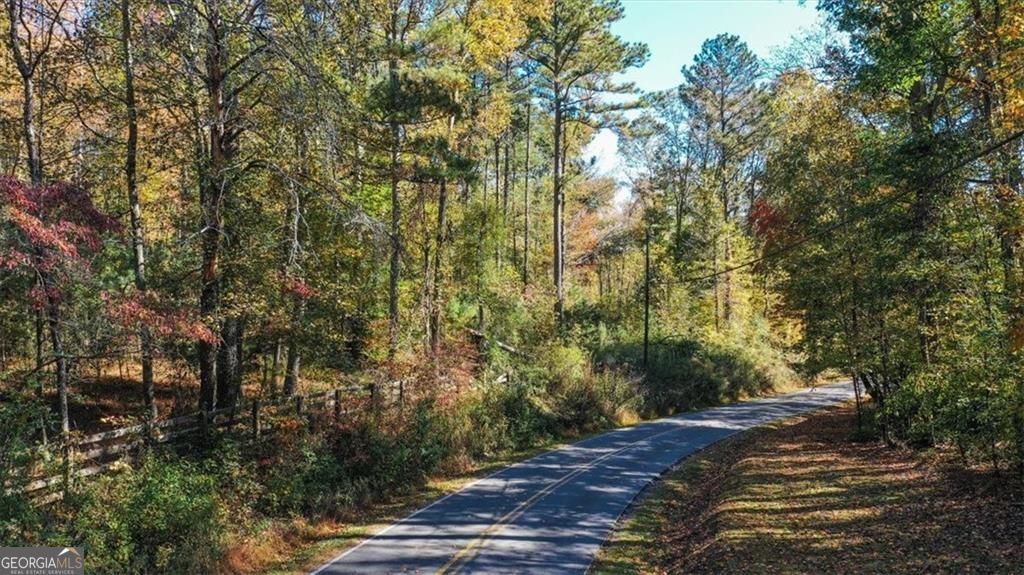 8205 Nicholson Road, Unit LOT 3 Cumming, GA 30028 - Photo 10 of 10 a view of a yard with plants and trees