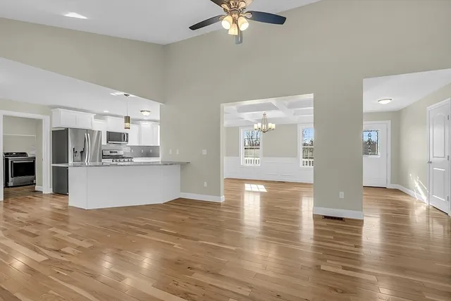 a view of kitchen with cabinets and wooden floor