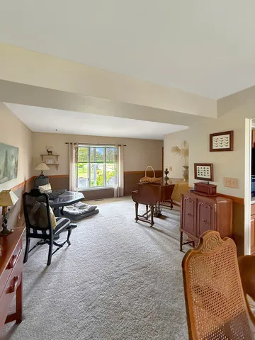 a bathroom with a granite countertop sink a toilet and a mirror
