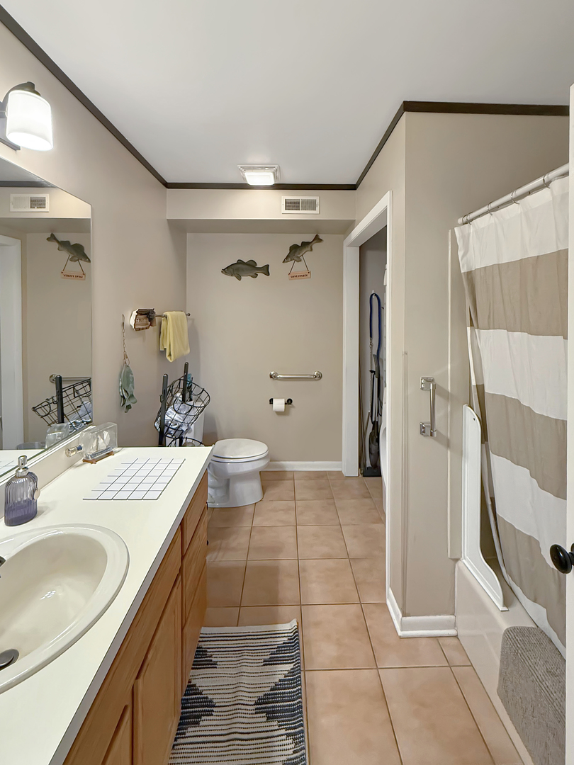 49W972 Peterson Road Maple Park, IL 60151 - Photo 15 of 38 a bathroom with a sink a toilet and shower