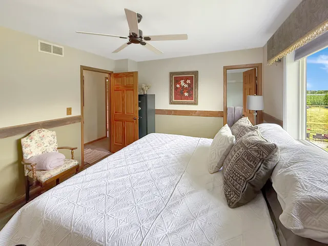 a bedroom with a bed and cabinets