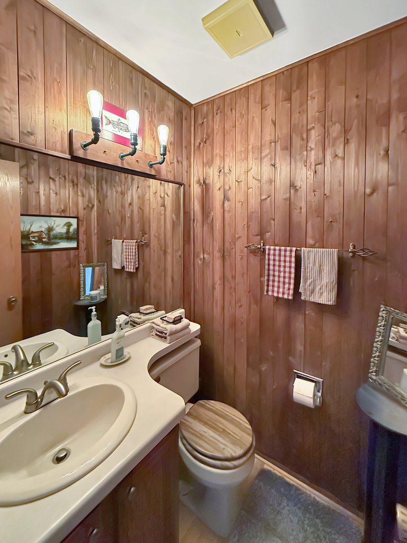 49W972 Peterson Road Maple Park, IL 60151 - Photo 19 of 38 a bathroom with a sink a toilet and shower curtain