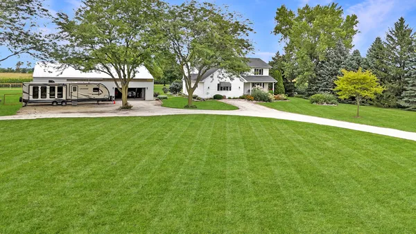 a view of a house with a yard
