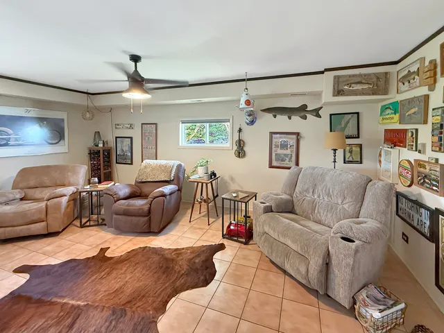 a kitchen with a sink a stove a refrigerator and a dining table