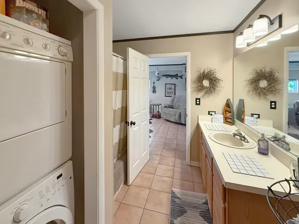 a kitchen with granite countertop a stove a sink and a microwave