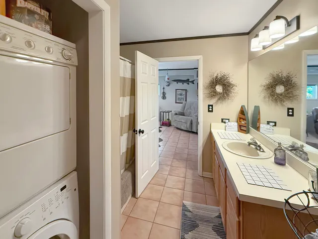 a kitchen with granite countertop a stove a sink and a microwave