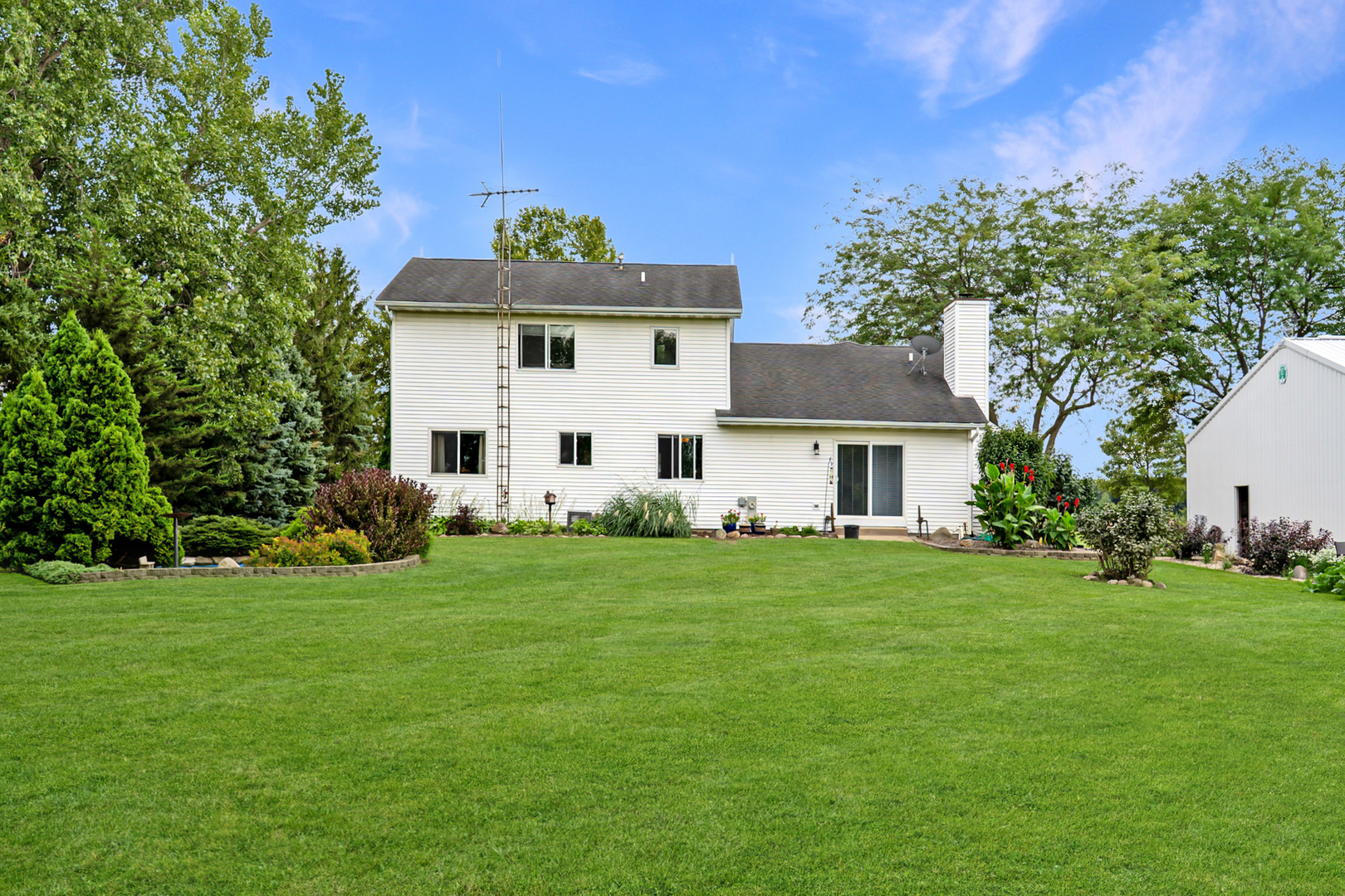49W972 Peterson Road Maple Park, IL 60151 - Photo 25 of 38 a front view of a house with a garden