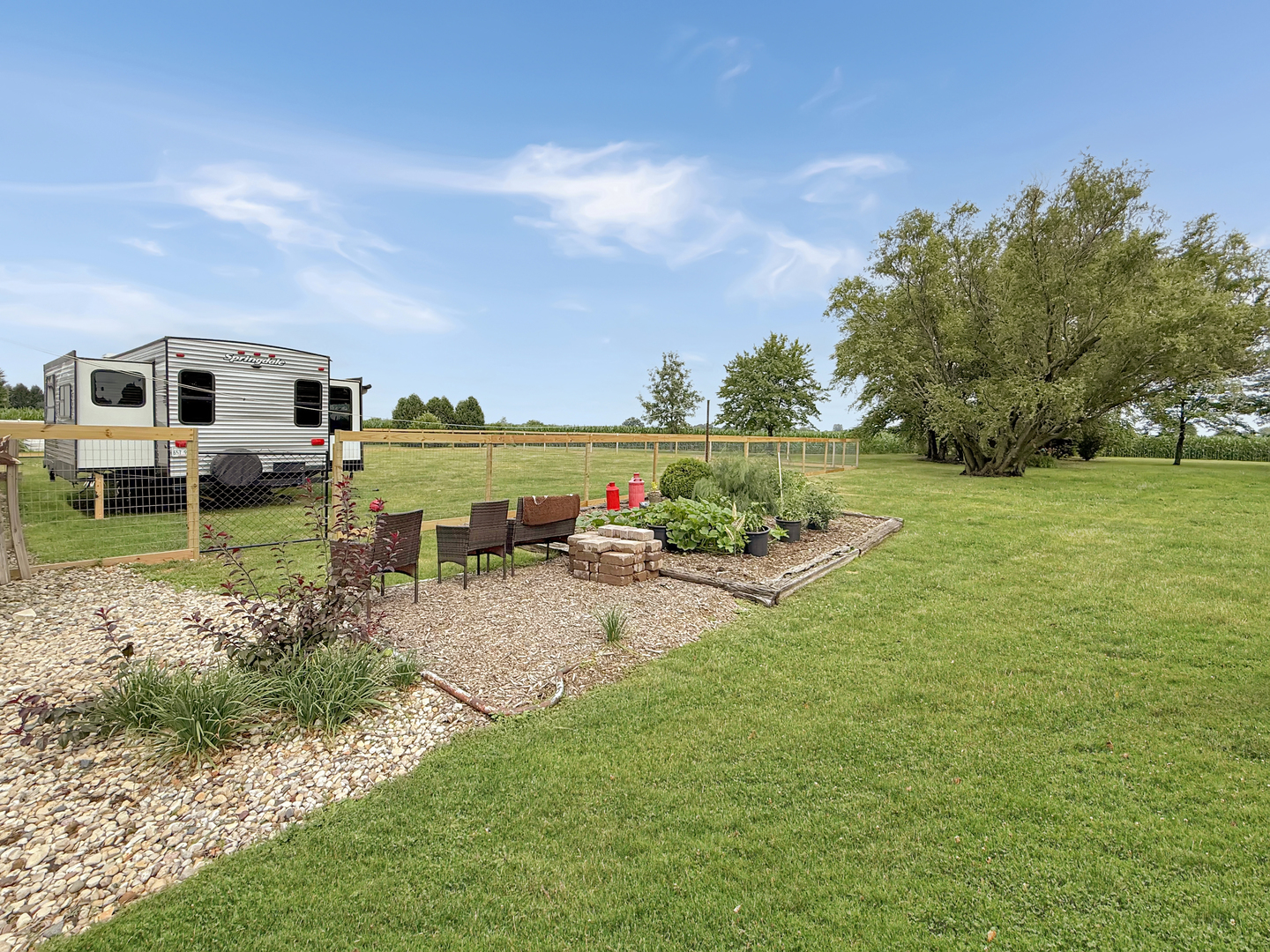 49W972 Peterson Road Maple Park, IL 60151 - Photo 33 of 38 a view of a house with backyard and sitting area