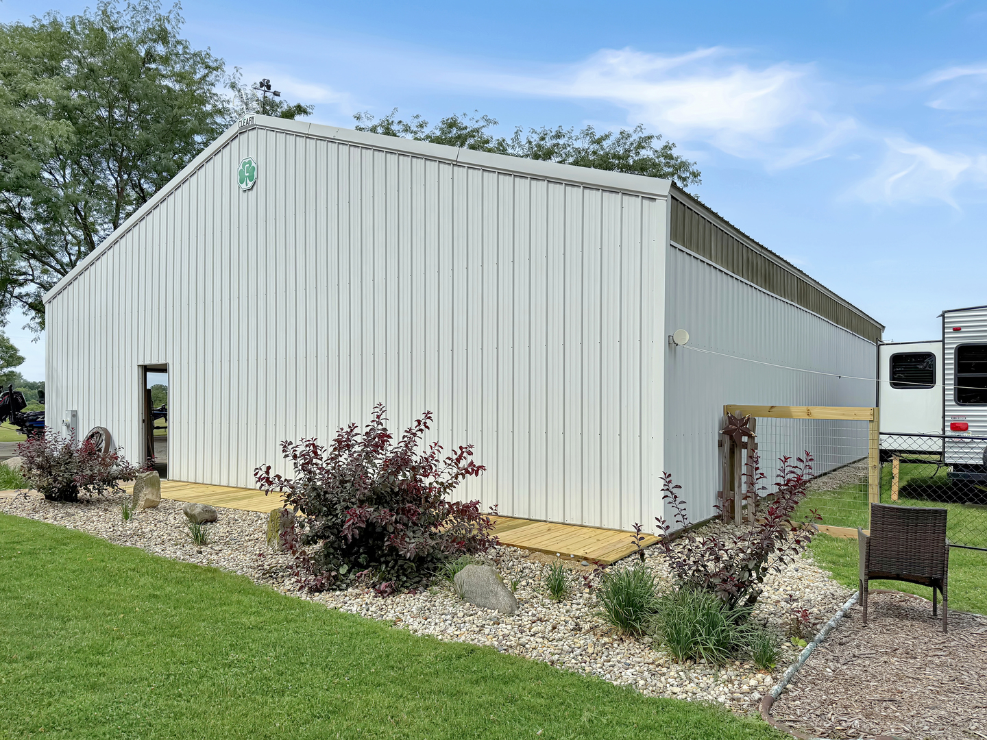 49W972 Peterson Road Maple Park, IL 60151 - Photo 36 of 38 a view of a backyard with plants and a large tree