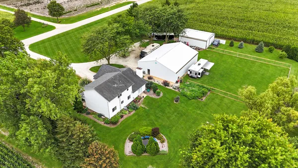 an aerial view of a house with a garden