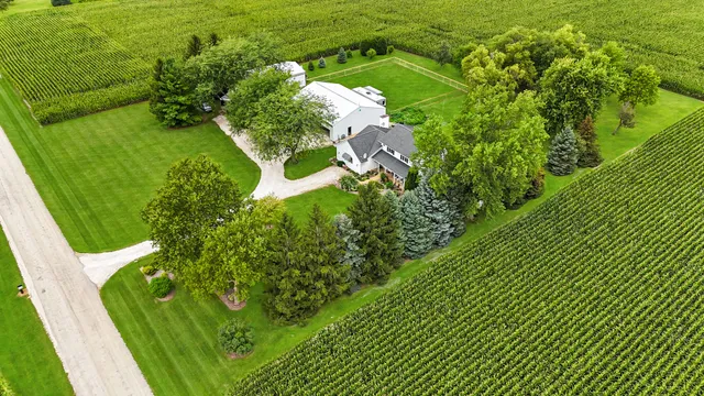 a kitchen with a stove a sink a dining table and chairs