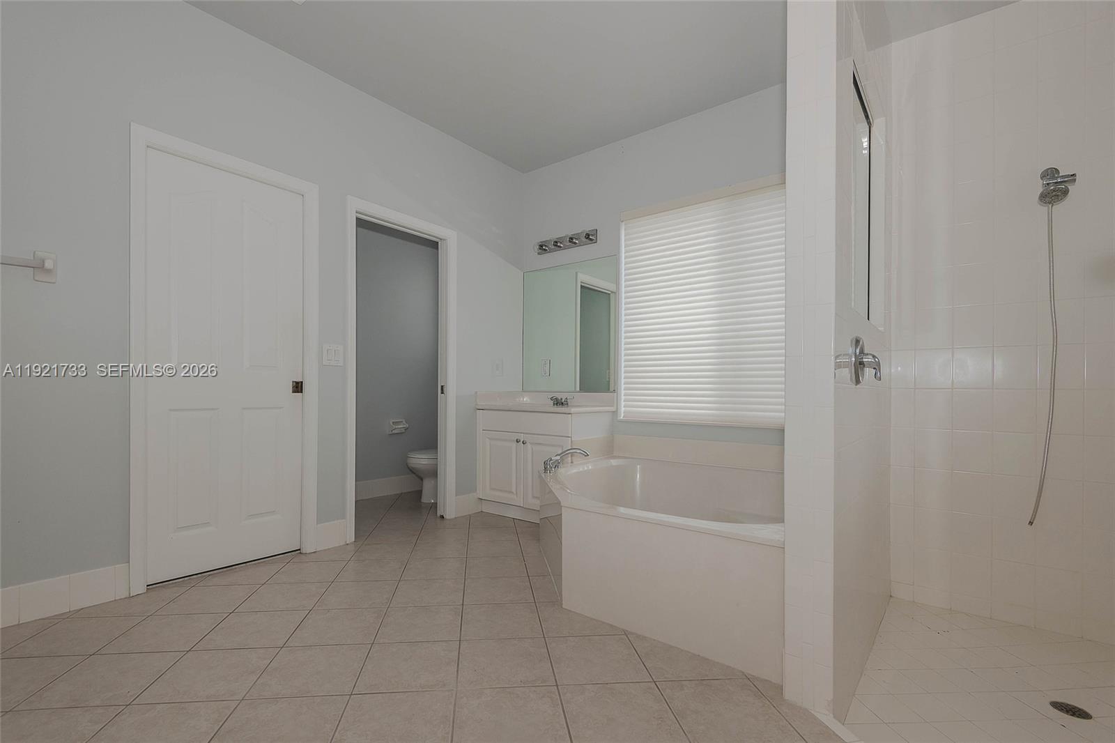 3843 Oak Ridge Circle Weston, FL 33331 - Photo 21 of 39 a bathroom with a bathtub and shower