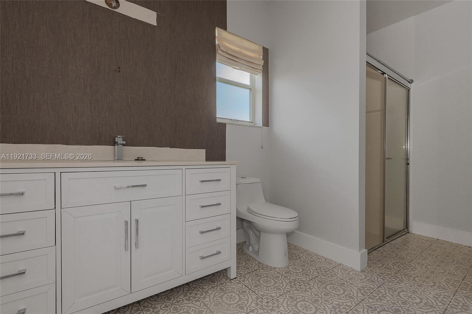 3843 Oak Ridge Circle Weston, FL 33331 - Photo 25 of 39 a bathroom with a toilet sink and mirror