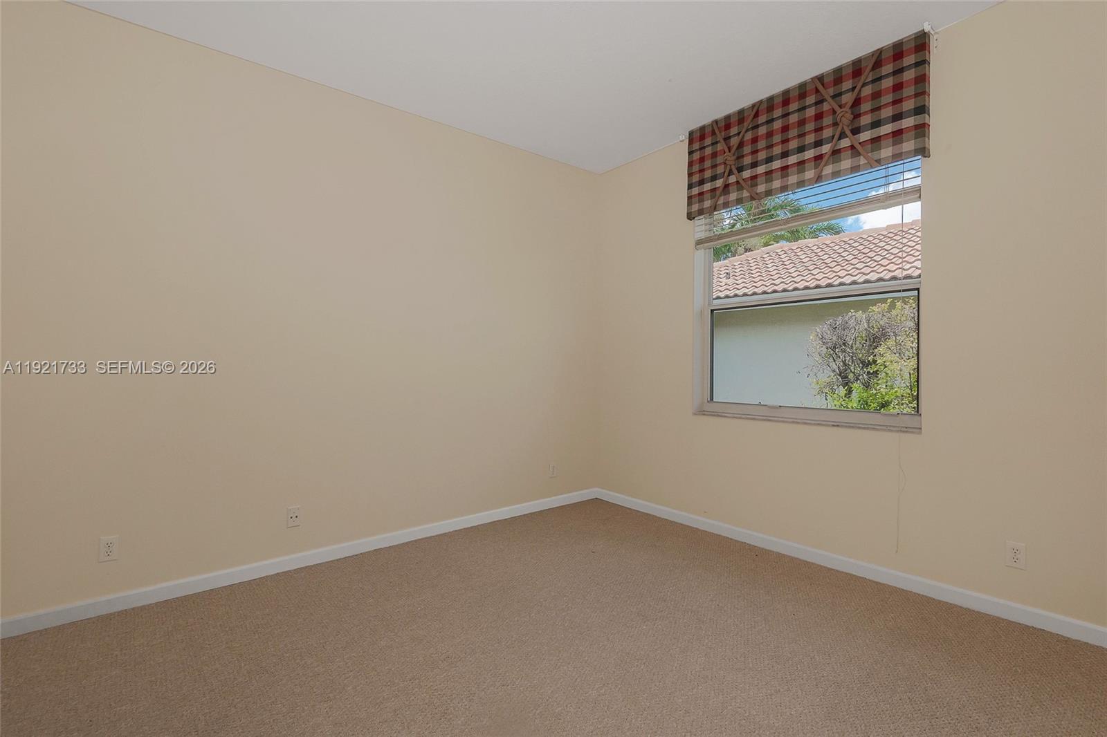 3843 Oak Ridge Circle Weston, FL 33331 - Photo 32 of 39 an empty room with a window