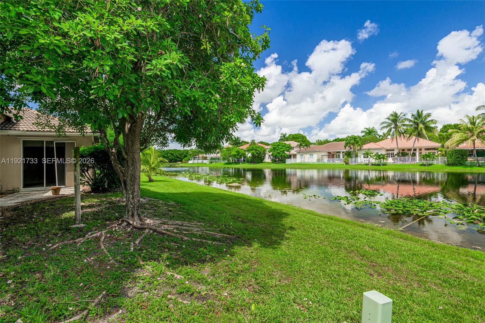 3843 Oak Ridge Circle Weston, FL 33331 - Photo 39 of 39 a view of a house with a yard