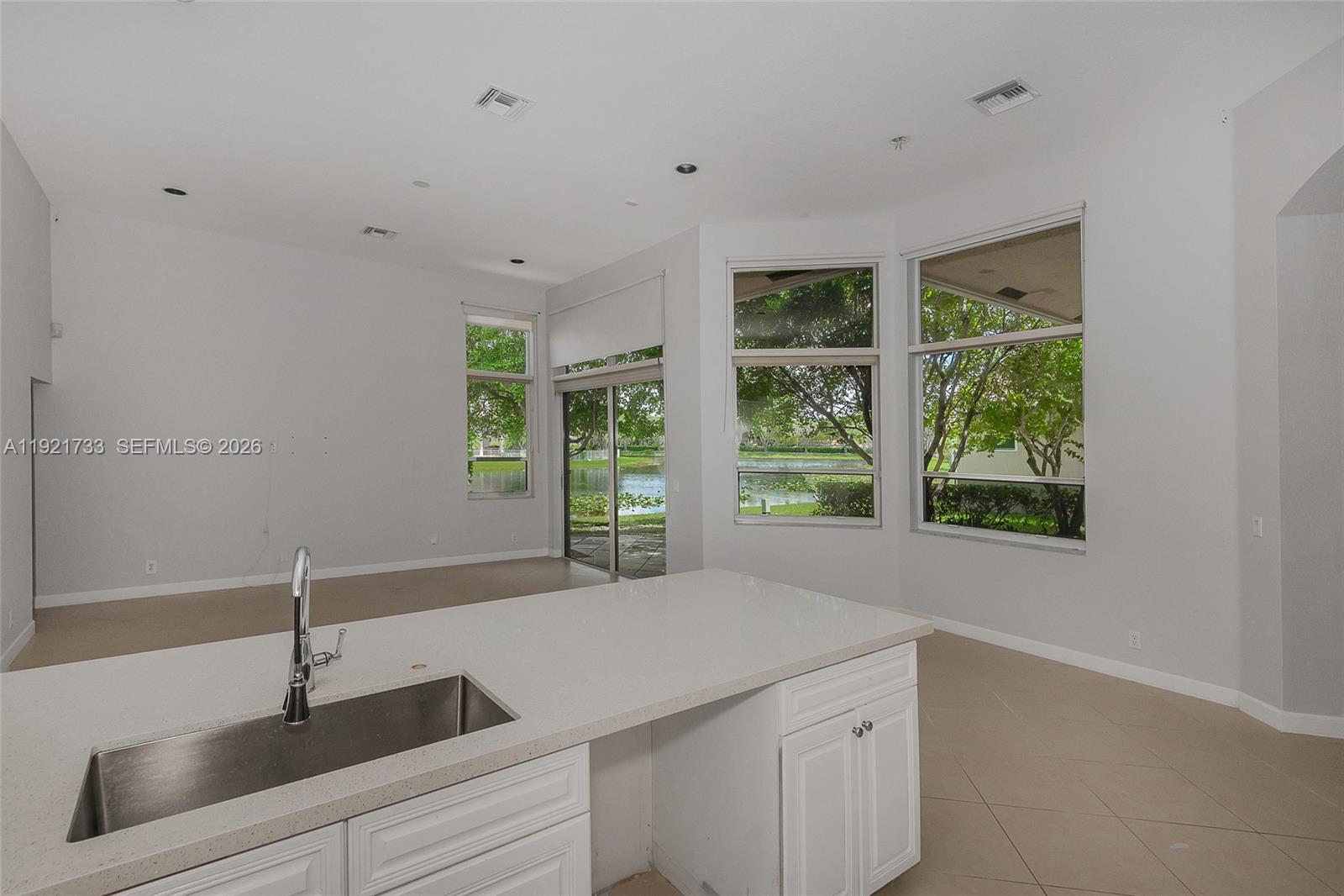 3843 Oak Ridge Circle Weston, FL 33331 - Photo 6 of 39 a kitchen with a sink and large window