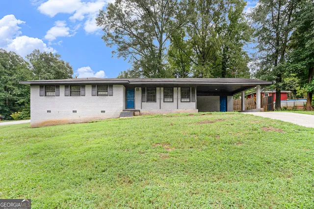 a front view of house with yard and green space