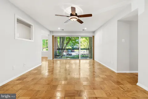 a view of an empty room with a window