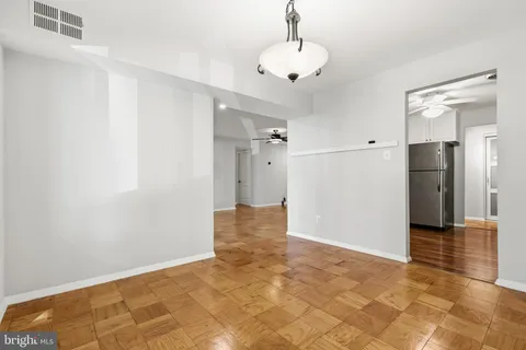 a kitchen with a sink cabinets and a stove