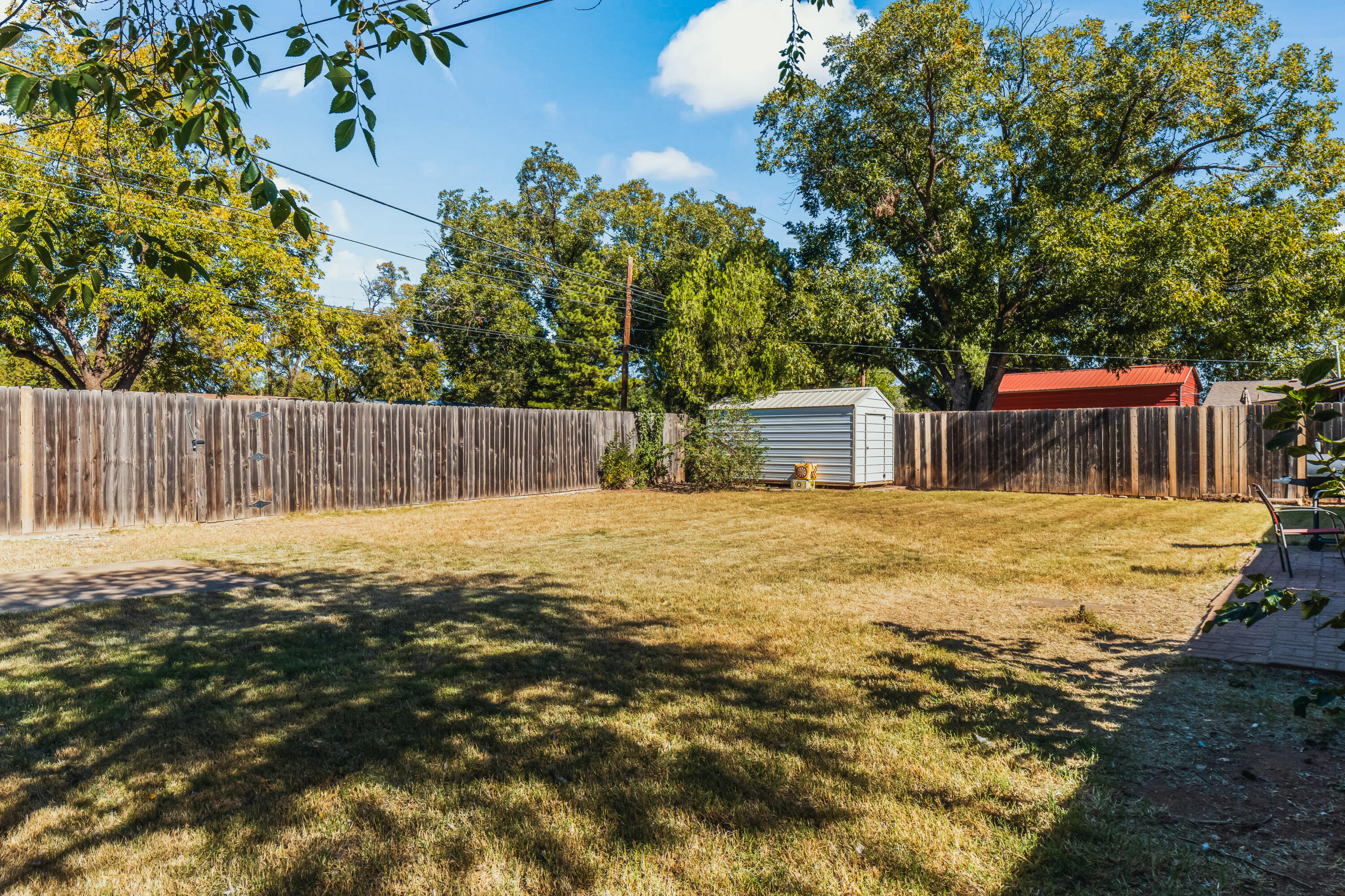 2510 59th Street Lubbock, TX 79413 - Photo 5 of 22 a backyard of a house with table and chairs