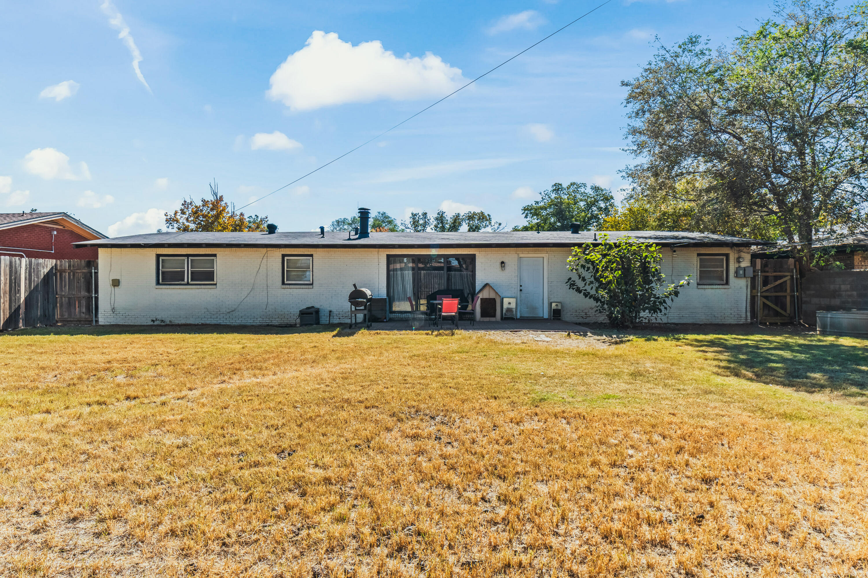 2510 59th Street Lubbock, TX 79413 - Photo 7 of 22 a front view of a house with a yard and potted plants
