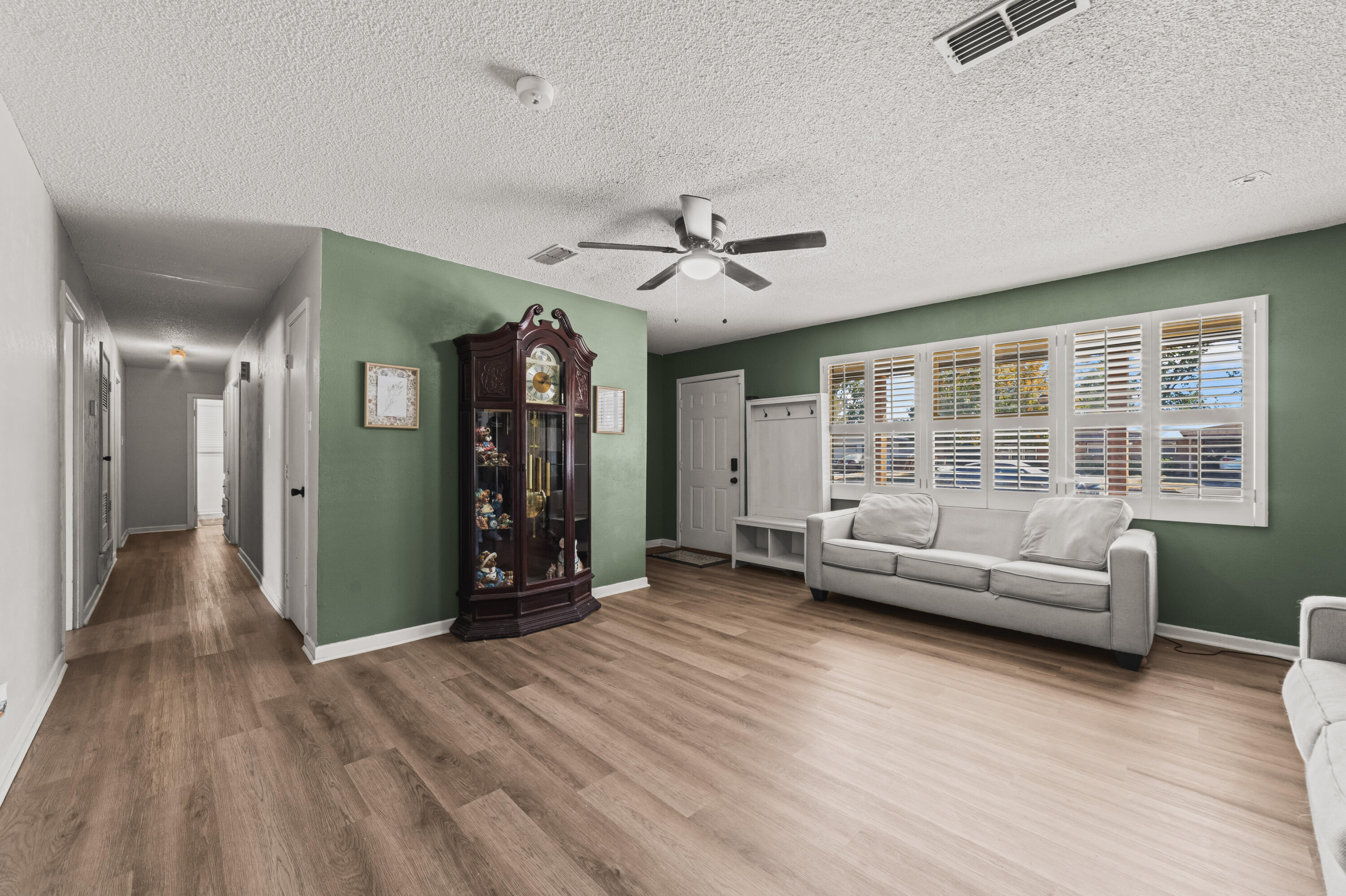 2510 59th Street Lubbock, TX 79413 - Photo 8 of 22 a living room with furniture and a large window with wooden floor