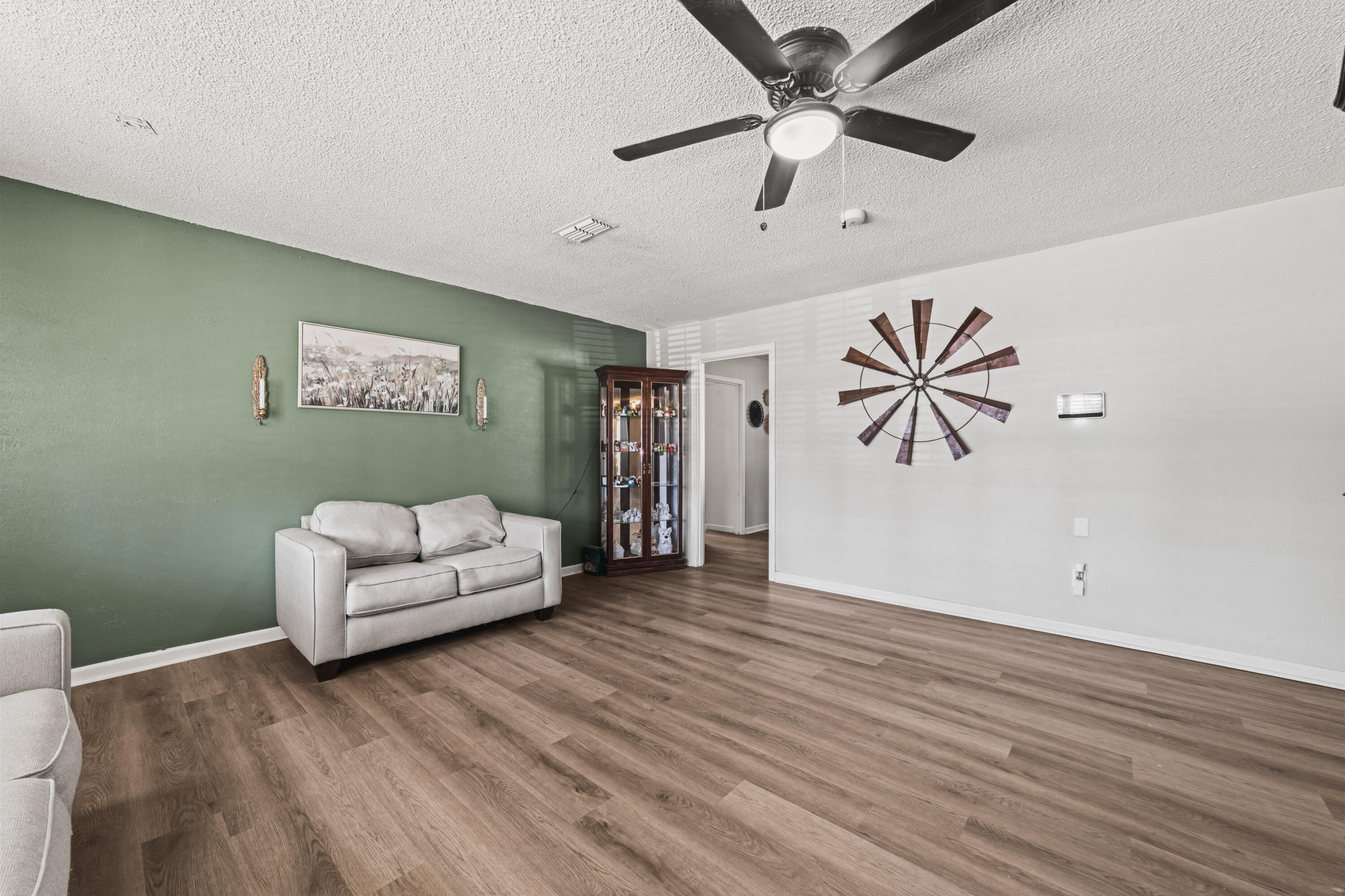 2510 59th Street Lubbock, TX 79413 - Photo 9 of 22 a living room with furniture and a ceiling fan