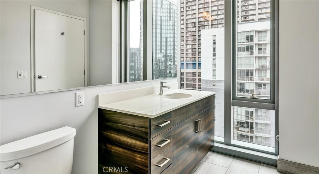 100 Van Ness Avenue, Unit 603 San Francisco, CA 94102 - Photo 7 of 75 a bathroom with a sink and a toilet
