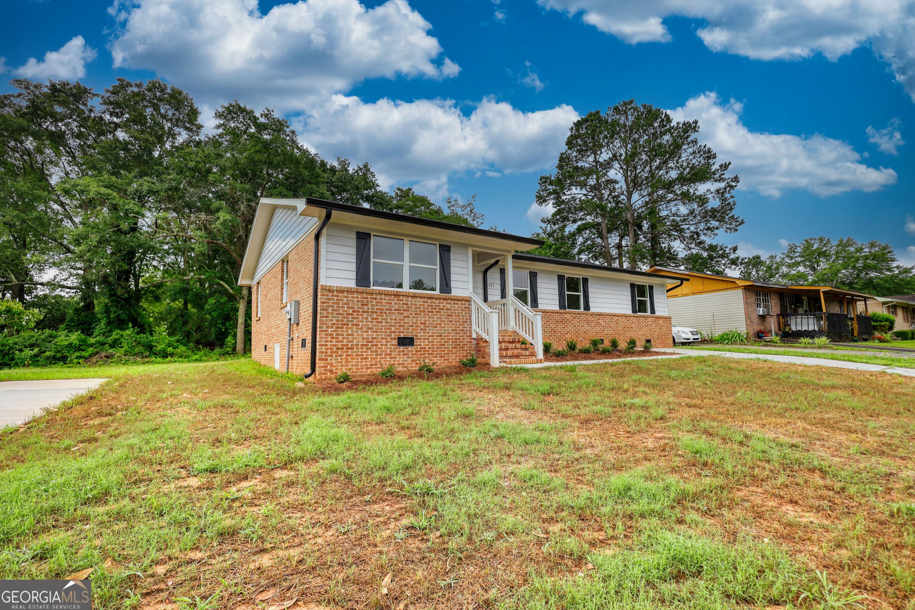 855 Meadow Ridge Drive Madison, GA 30650 - Photo 4 of 41 a front view of house with yard and trees