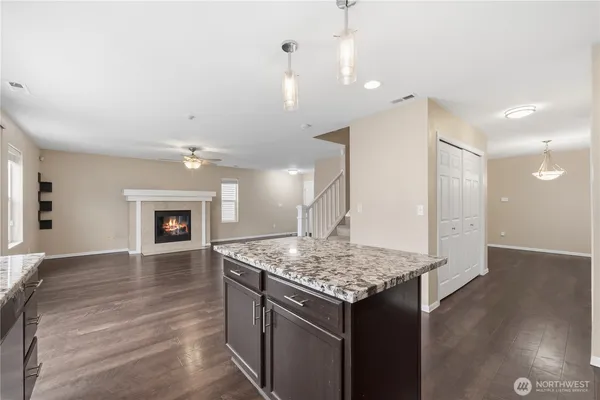 a kitchen with a table and chairs in it