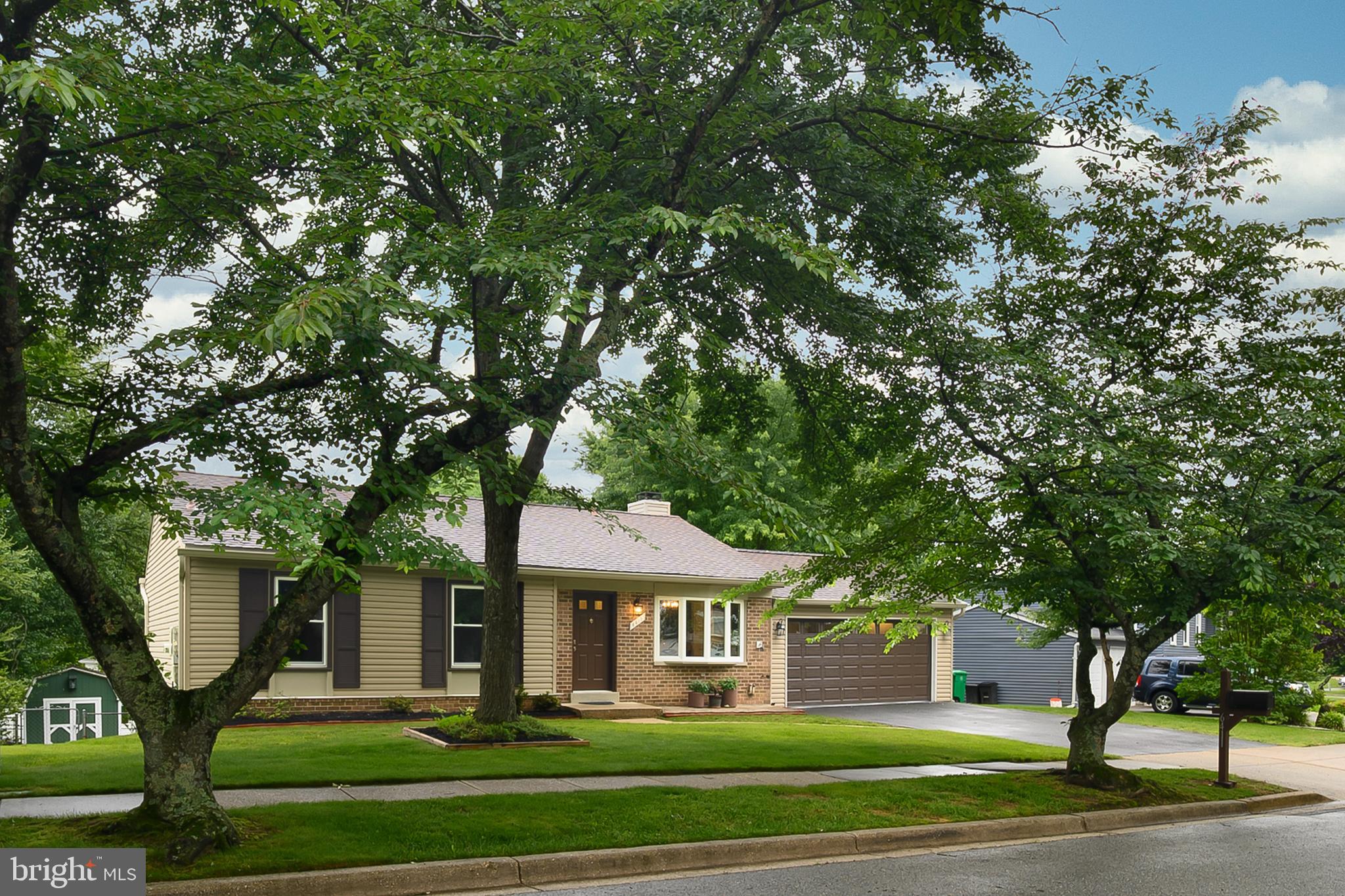 6411 Darwin Road Laurel, MD 20707 - Photo 1 of 41 a front view of a house with a garden