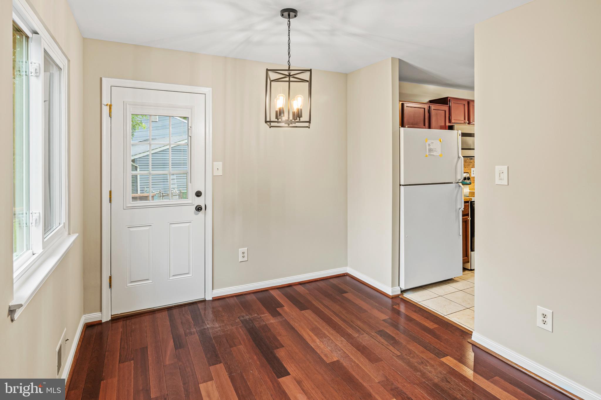 6411 Darwin Road Laurel, MD 20707 - Photo 12 of 41 a view of a hallway with wooden floor and entryway