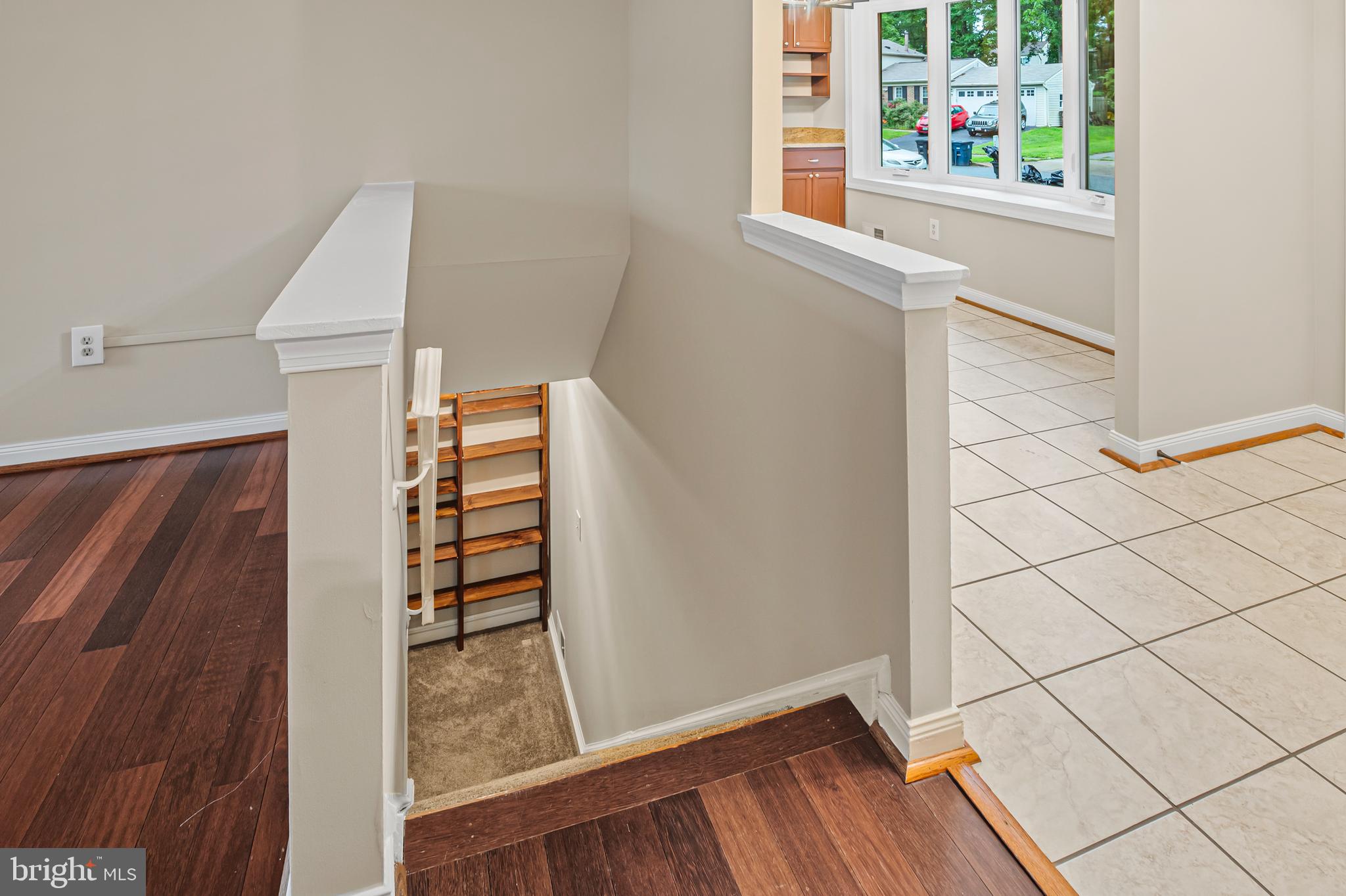 6411 Darwin Road Laurel, MD 20707 - Photo 23 of 41 a view of a hallway with wooden floor and staircase