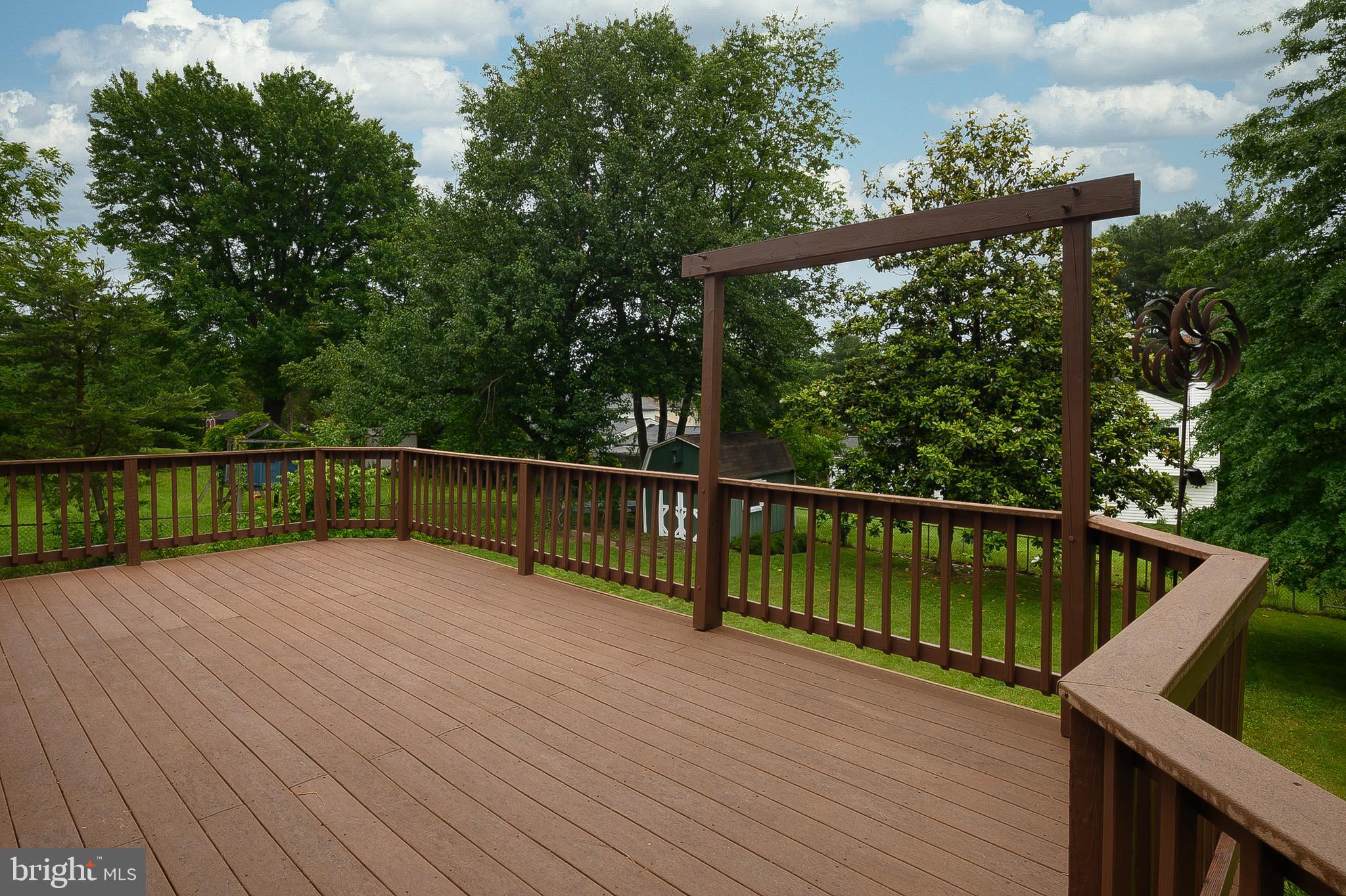 6411 Darwin Road Laurel, MD 20707 - Photo 31 of 41 a view of deck with wooden floor and outdoor seating