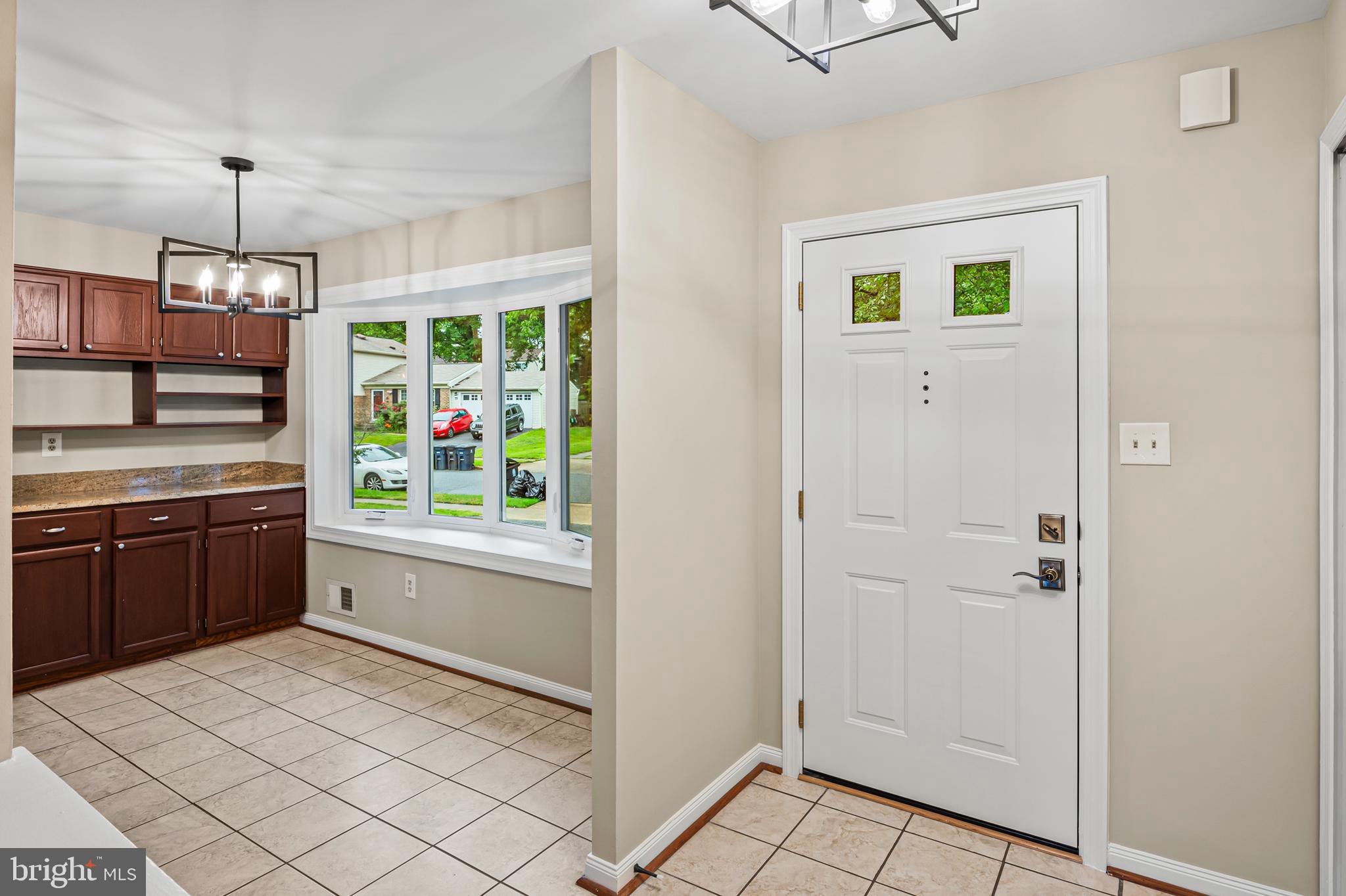 6411 Darwin Road Laurel, MD 20707 - Photo 5 of 41 a kitchen with stainless steel appliances granite countertop a refrigerator and a sink