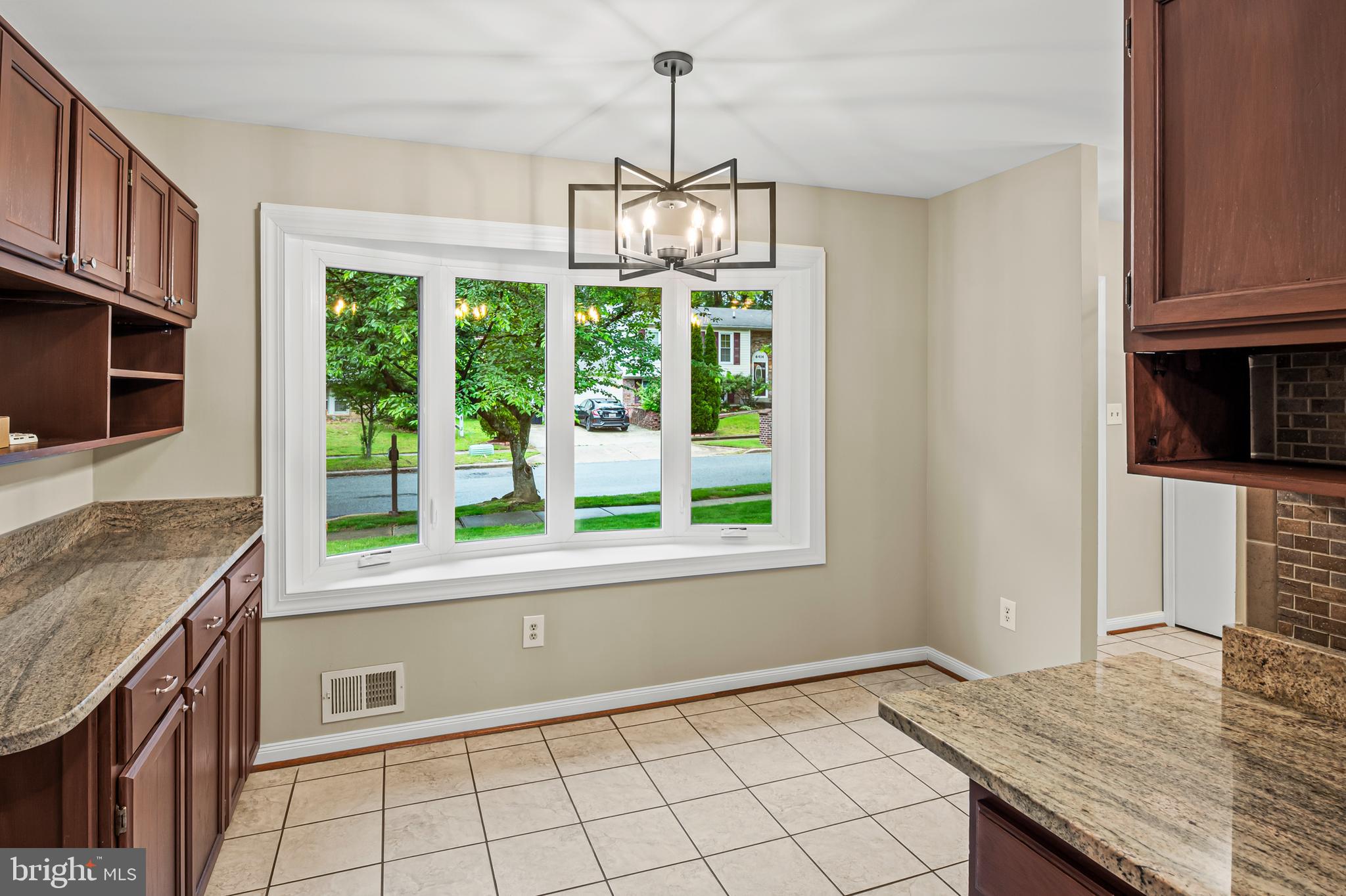 6411 Darwin Road Laurel, MD 20707 - Photo 6 of 41 a kitchen with granite countertop a stove and a sink