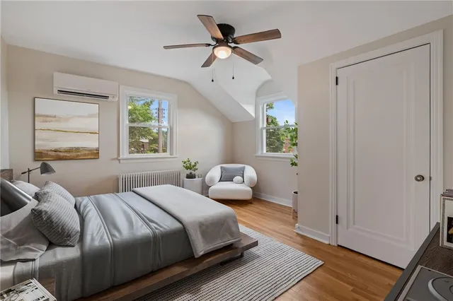 a bedroom with bed and window