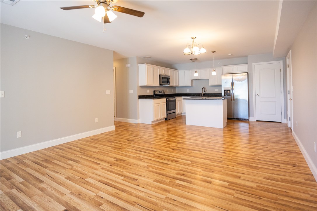 9 Gray Coach Lane, Unit 905 Cranston, RI 02921 - Photo 6 of 19 Living to kitchen