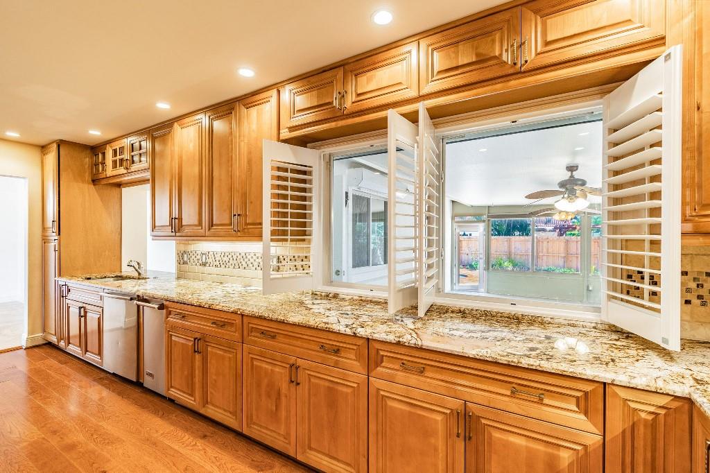 2650 Northeast 52nd Street Lighthouse Point, FL 33064 - Photo 13 of 35 a bathroom with a granite countertop sink and large window