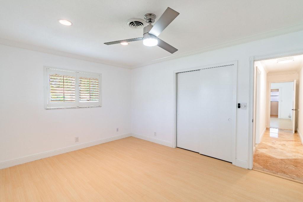 2650 Northeast 52nd Street Lighthouse Point, FL 33064 - Photo 21 of 35 an empty room with closet and windows