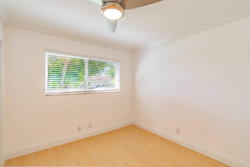 2650 Northeast 52nd Street Lighthouse Point, FL 33064 - Photo 25 of 35 an empty room with a window