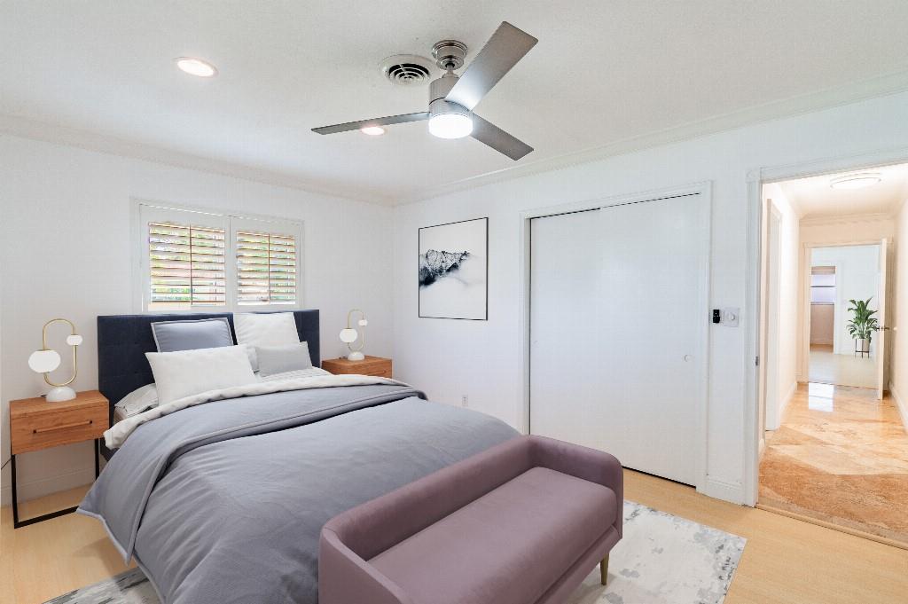 2650 Northeast 52nd Street Lighthouse Point, FL 33064 - Photo 5 of 35 a bedroom with a bed couch and window